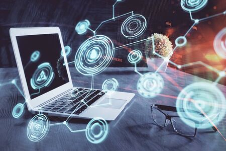 Computer on desktop with social network hologram. Multi exposure. Concept of international people...