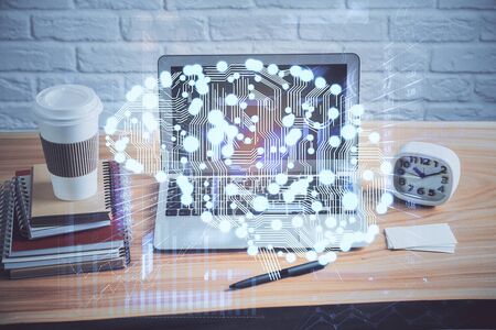 Double exposure of table with computer and brain hologram. Data innovation concept.の写真素材