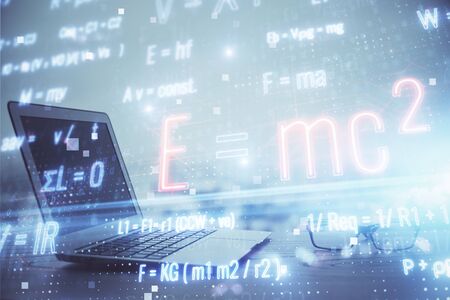 Desktop computer background and formula hologram writing. Double exposure. Education concept.
