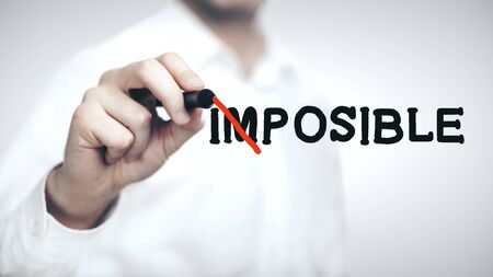 businessman drawing impossible concept on white  backgroundの写真素材
