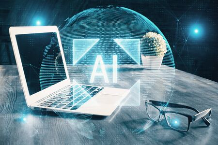 Double exposure of laptop computer and technology theme hologram. Concept of freelance work.の写真素材