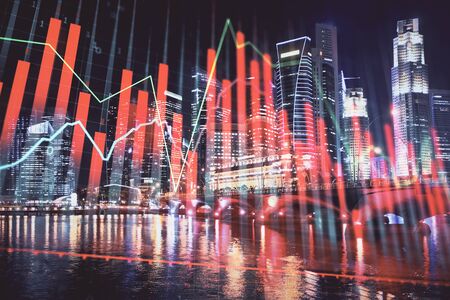 Financial chart on city scape with tall buildings background multi exposure. Analysis concept.の写真素材