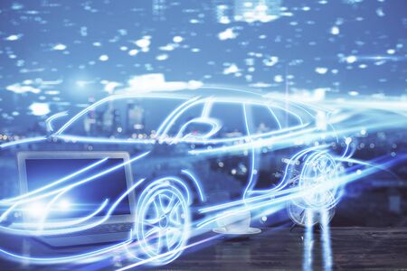 Desktop computer background in office with automobile hologram drawing. Multi exposure. Tech concept.の写真素材