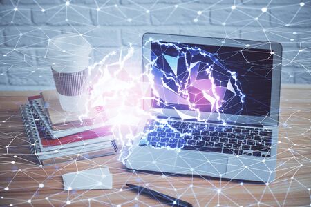 Double exposure of table with computer and brain hologram. Data innovation concept.の写真素材