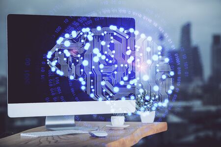 Double exposure of table with computer and brain hologram. Data innovation concept.