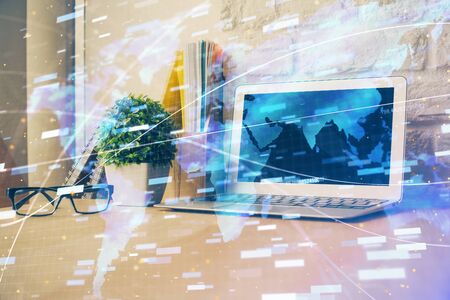 Double exposure of desktop computer and technology theme hologram. Concept of software development.の写真素材