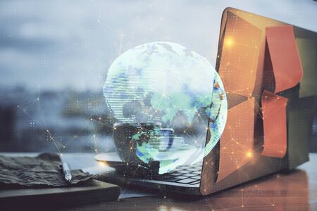 Computer on desktop with social network hologram. Multi exposure. Concept of international people connections.の写真素材