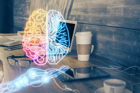 Multi exposure of work table with computer and brain hologram. Brainstorm concept.の写真素材