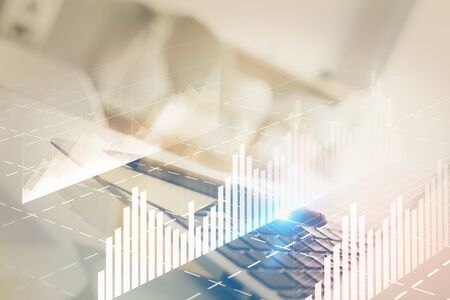 Forex Chart hologram on table with computer background. Multi exposure. Concept of financial...