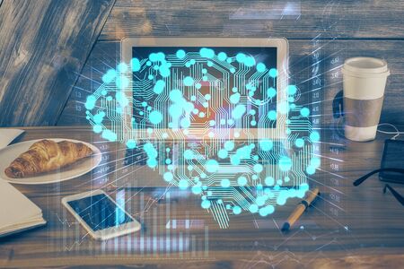Multi exposure of work table with computer and brain hologram. Brainstorm concept.の写真素材