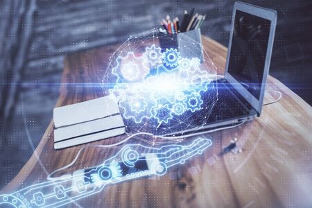 Technology theme drawing and table with computer. Double exposure. Concept of information.の写真素材
