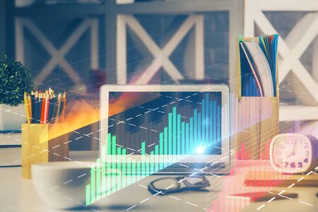 Double exposure of forex chart and work space with computer. Concept of international online...