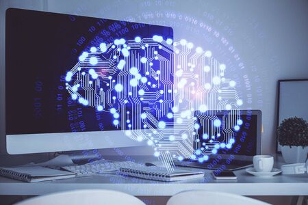 Double exposure of table with computer and brain hologram. Data innovation concept.の写真素材