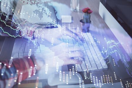 Double exposure of stock market chart with man working on computer on background. Concept of financial analysis.の写真素材