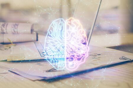 Multi exposure of work space with computer and human brain hologram. Brainstorm concept.