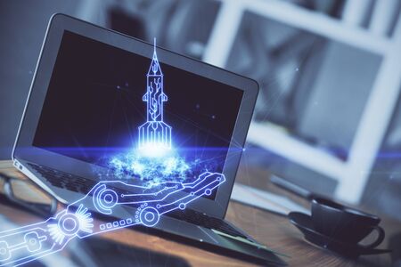 Desktop computer background in office and start up theme hologram drawing. Double exposure. Startup...