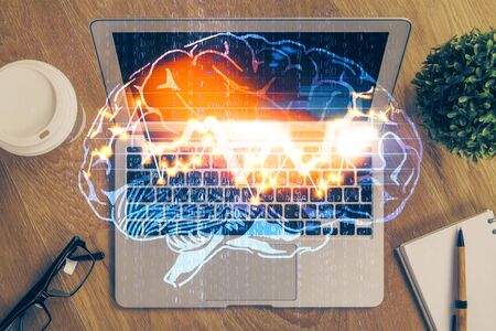 Multi exposure of work table with computer and brain hologram. Brainstorm concept.の写真素材