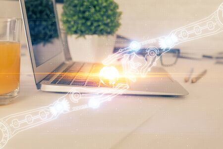 Double exposure of laptop computer and technology theme hologram. Concept of freelance work.