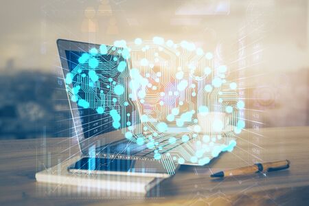 Multi exposure of work table with computer and brain hologram. Brainstorm concept.の写真素材