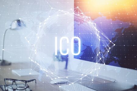 Multi exposure of blockchain and crypto economy theme hologram and table with computer background. Concept of bitcoin cryptocurrency.の写真素材