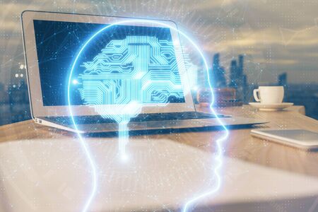 Multi exposure of work space with computer and human brain hologram. Brainstorm concept.