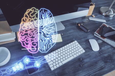 Double exposure of table with computer and brain hologram. Data innovation concept.の写真素材