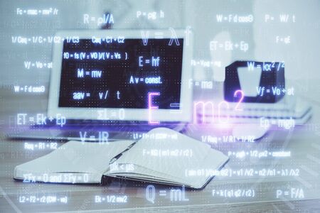 Desktop computer background and formula hologram writing. Double exposure. Education concept.