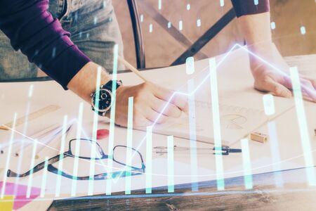 Multi exposure of man standing and planing investment with stock market forex chart background. Concept of research and trading.の写真素材