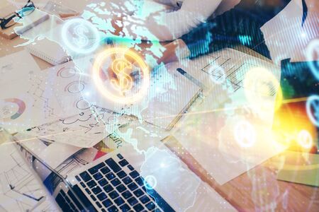 A woman hands writing information about stock market in notepad. Forex chart holograms in front. Concept of research. Double exposureの写真素材