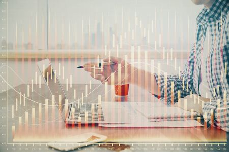 Multi exposure of stock market chart with man working on computer on background. Concept of financial analysis.の写真素材