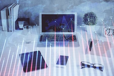 Forex market graph hologram and personal computerの写真素材