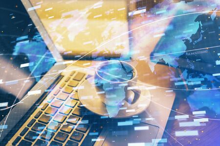Double exposure of desktop computer and technology theme hologram. Concept of software development.