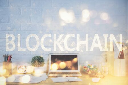 Multi exposure of blockchain and crypto economy theme hologram and table with computer background. Concept of bitcoin cryptocurrency.の写真素材