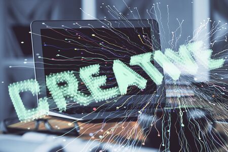 Desktop computer background in office and start up theme hologram drawing. Double exposure. Startup concept.の写真素材