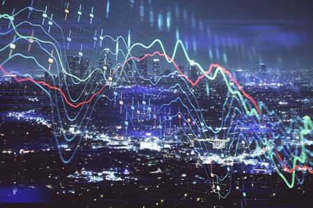 Financial graph on night city scape with tall buildings background multi exposure. Analysis concept.の写真素材