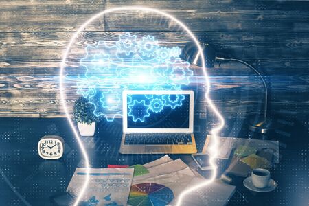 Multi exposure of work space with computer and human brain hologram. Brainstorm concept.