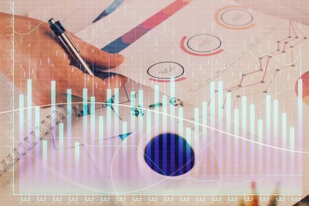 Multi exposure of man planing investment with stock market forex chart background. Concept of research and trading.の写真素材