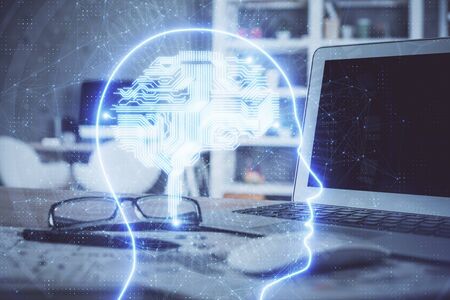 Double exposure of table with computer and brain hologram. Data innovation concept.