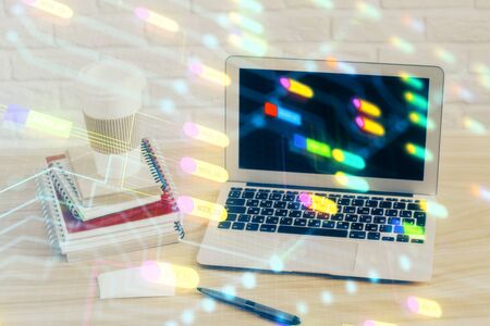 Double exposure of desktop computer and technology theme hologram. Concept of software development.の写真素材