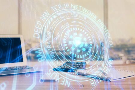 Double exposure of desktop computer and technology theme hologram. Concept of software development.
