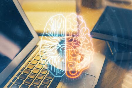 Double exposure of work space with computer and human brain drawing hologram. Brainstorm concept.の写真素材