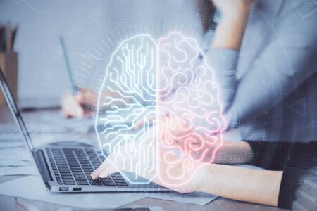 Multi exposure of woman hands working on computer and brain hologram drawing. Ai concept.