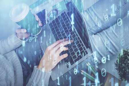 Double exposure of woman hands working on computer and data theme hologram drawing. Tech concept.