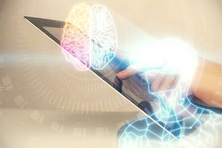 Double exposure of man's hands holding and using a digital device and AR glasses drawing. Virtual...