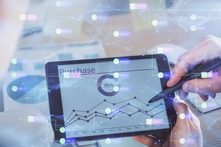 Multi exposure of mans hands holding and using a digital device and data theme drawing. Innovation concept.の写真素材