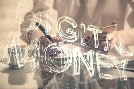 Double exposure of blockchain business sketch hologram and woman holding and using a mobile device.の写真素材