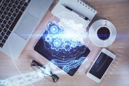 Double exposure of technology theme drawing over work table desktop. Top view. Global data analysis concept.の写真素材