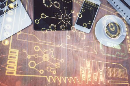 Double exposure of technology theme drawing over work table desktop. Top view. Global data analysis concept.の写真素材