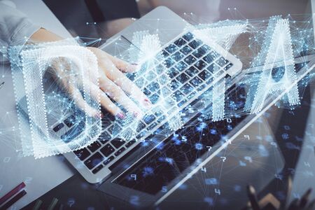Multi exposure of woman hands working on computer and data theme hologram drawing. Tech concept.