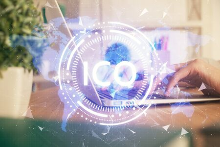 Double exposure of woman hands typing on computer and crypto market theme hologram drawing. Blockchain concept.の写真素材